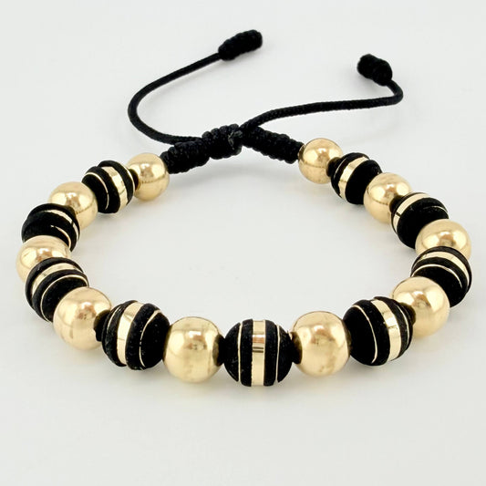 Pulsera Negra Neoros 9und Bolas 10und 2.5gr / 7mm Oro Amarillo 18K ©