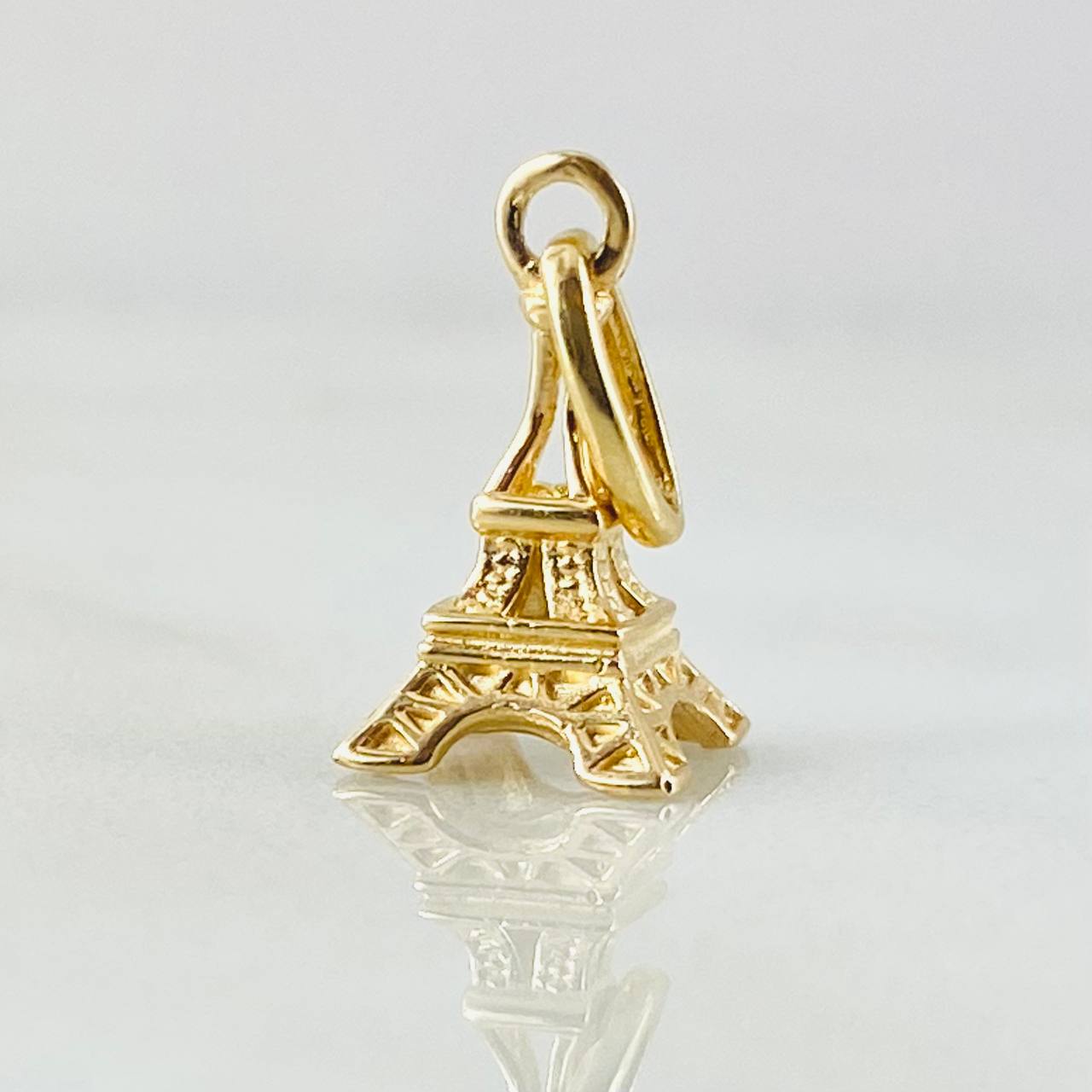 Dije Torre Eiffel 1.05gr / 1.9cm / Oro Amarillo 18K © Dije Torre Eiffel 1.05gr / 1.9cm / Oro Amarillo 18K ©