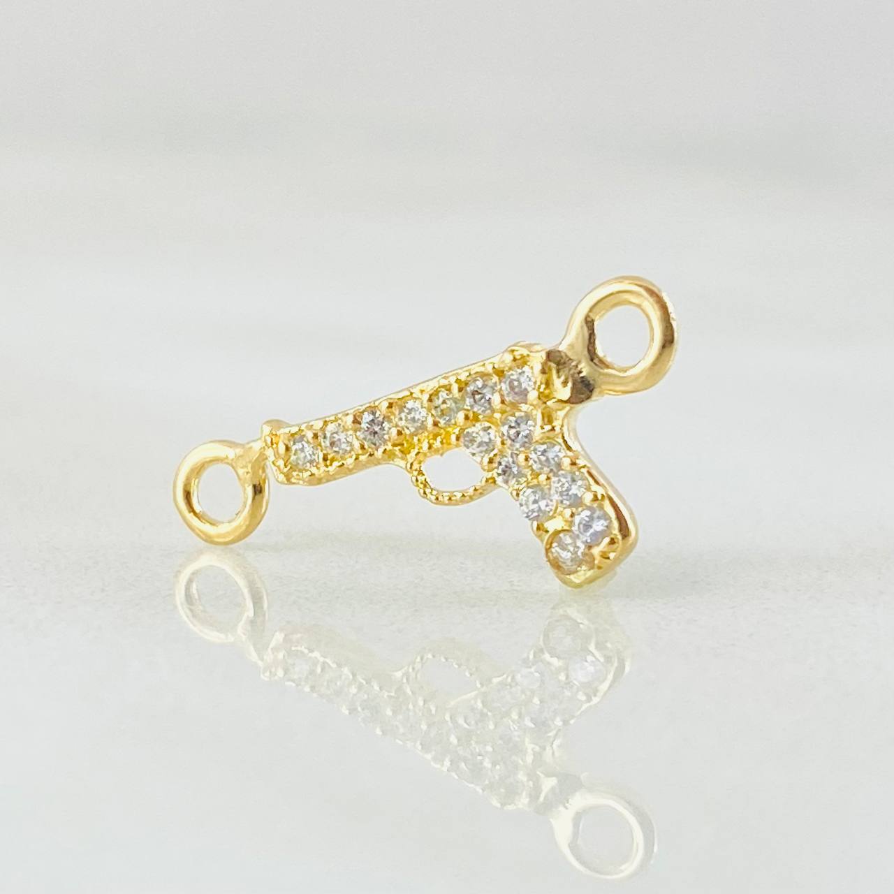 Herraje Arma Pistola Tupida 0.45gr / 1.7cm / Oro Amarillo 18K Herraje Arma Pistola Tupida 0.45gr / 1.7cm / Oro Amarillo 18K