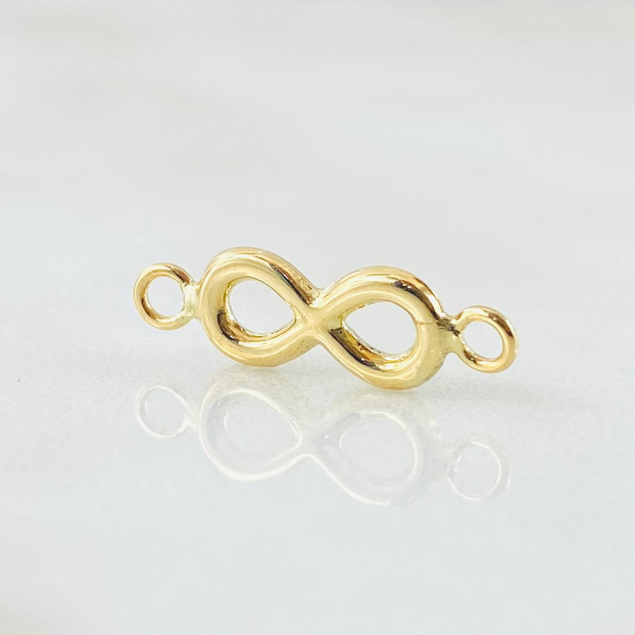 Herraje Infinito 0.65gr / 0.7cm / Oro Amarillo 18K * Herraje Infinito 0.65gr / 0.7cm / Oro Amarillo 18K *