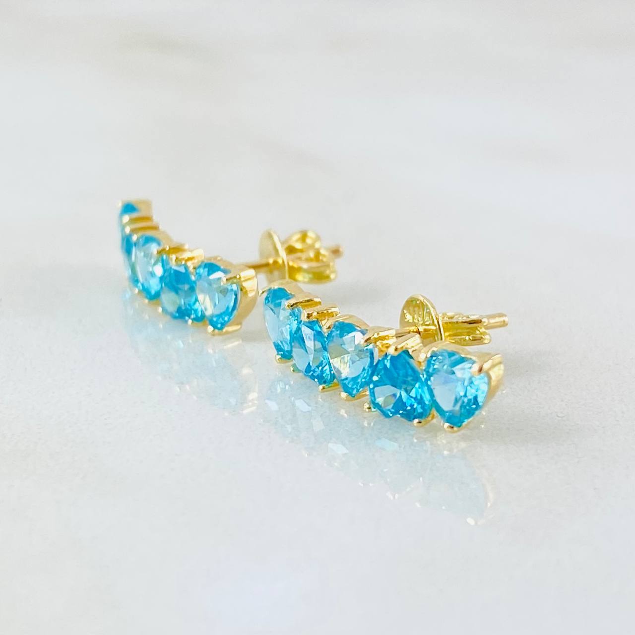 Topos Línea Corazones Celestes 2.7gr / Oro Amarillo 18K Topos Línea Corazones Celestes 2.7gr / Oro Amarillo 18K