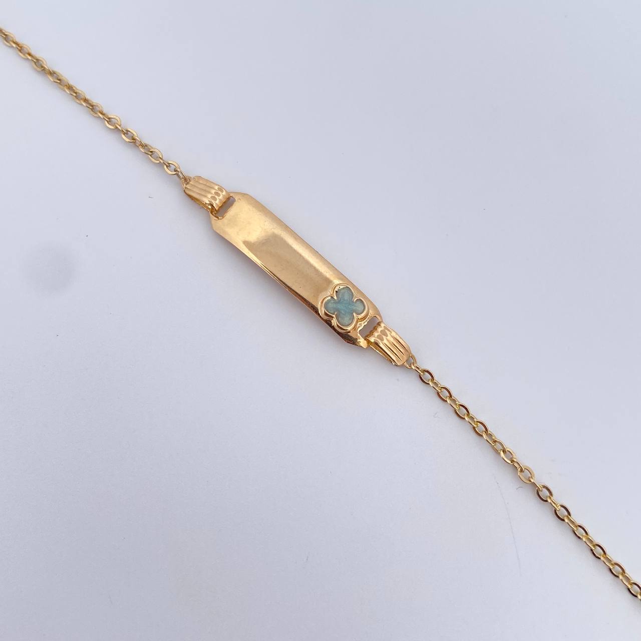 Pulso Bebe Aro Seguido 1.5gr / 14.2cm / 1mm Placa Rectangular Trebol Tornazol Oro Amarillo 18K $ Pulso Bebe Aro Seguido 1.5gr / 14.2cm / 1mm Placa Rectangular Trebol Tornazol Oro Amarillo 18K $