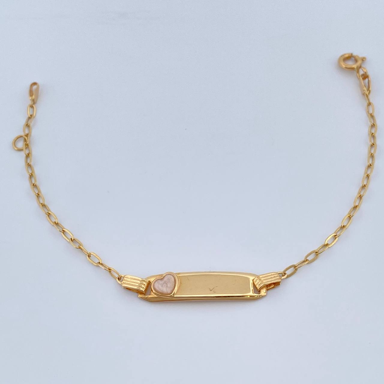 Pulso Bebe Cajon Corazon Rosado 1.5gr / 13.4cm-14.7cm / 1.8mm Placa Rectangular Curva Oro Amarillo 18K $ Pulso Bebe Cajon Corazon Rosado 1.5gr / 13.4cm-14.7cm / 1.8mm Placa Rectangular Curva Oro Amarillo 18K $