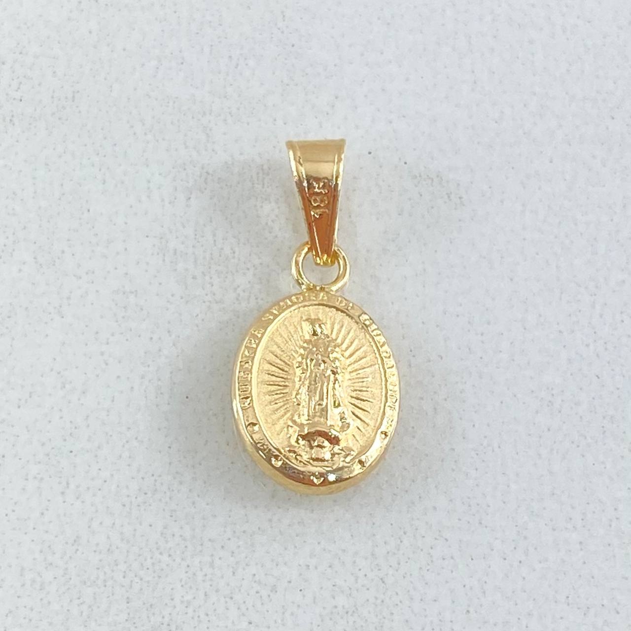 Dije Virgen Guadalupe 0.5gr / 1.8cm / Oro Amarillo 18K © Dije Virgen Guadalupe 0.5gr / 1.8cm / Oro Amarillo 18K ©