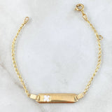 Pulso Bebé Espiga Placa Rectangular Trebol 1.75gr / 12cm-14cm / 1.6mm Resina Blanca Graduable Oro Amarillo 18K © Pulso Bebé Espiga Placa Rectangular Trebol 1.75gr / 12cm-14cm / 1.6mm Resina Blanca Graduable Oro Amarillo 18K ©