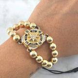 Pulsera Negra Brujula Elemental 17.1gr / 8mm Bolas Lisas 16 Und Oro Amarillo 18K © Pulsera Negra Brujula Elemental 17.1gr / 8mm Bolas Lisas 16 Und Oro Amarillo 18K ©