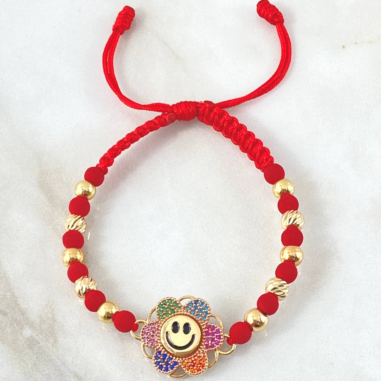 Pulsera Roja Herraje Flor Cara Feliz 5.85gr / Dos Oros Amarillo Rosa 18K © Pulsera Roja Herraje Flor Cara Feliz 5.85gr / Dos Oros Amarillo Rosa 18K ©