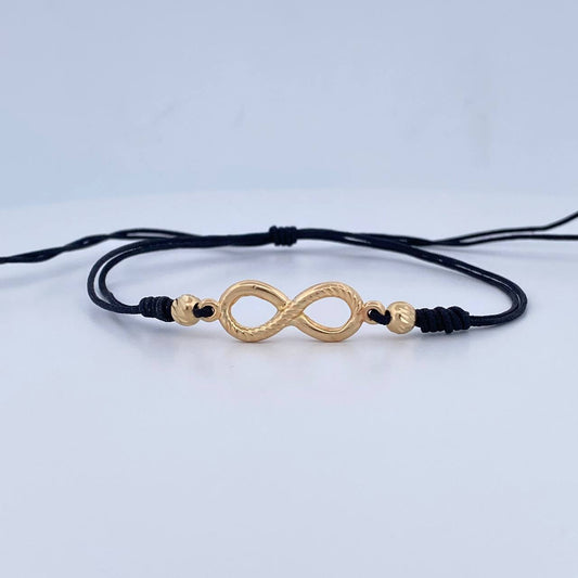 Pulsera Tejida Negra Infinito 1.3gr / Oro Amarillo 18K $