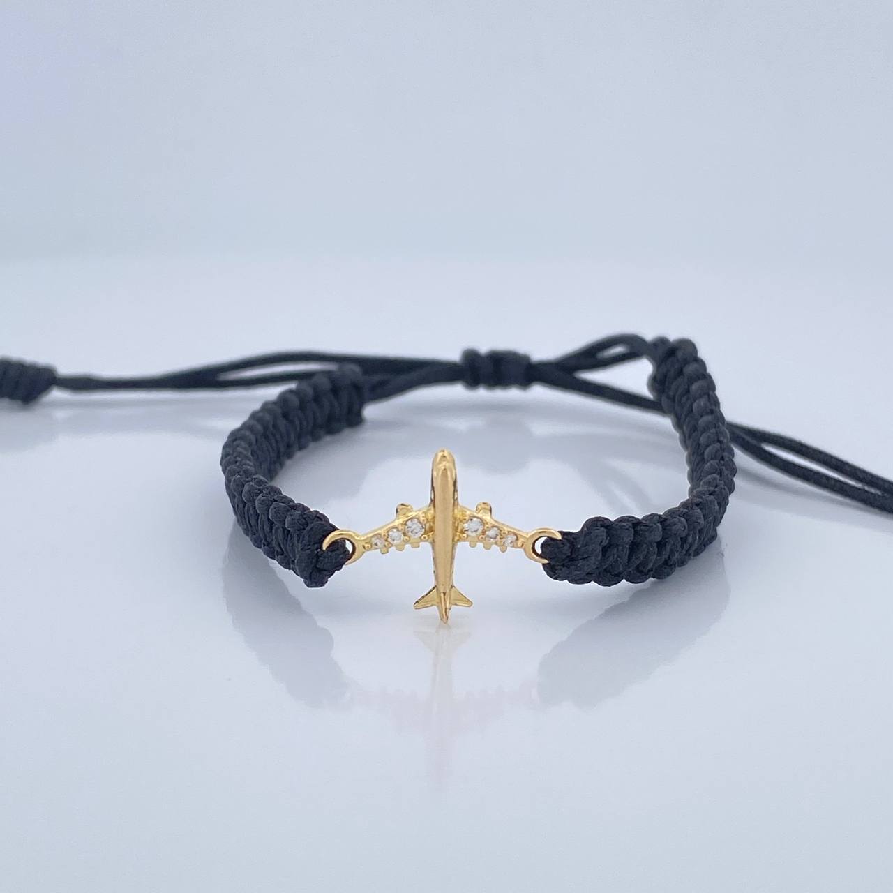 Pulsera Tejida Negra Avión 0.6gr / Oro Amarillo 18K % Pulsera Tejida Negra Avión 0.6gr / Oro Amarillo 18K %