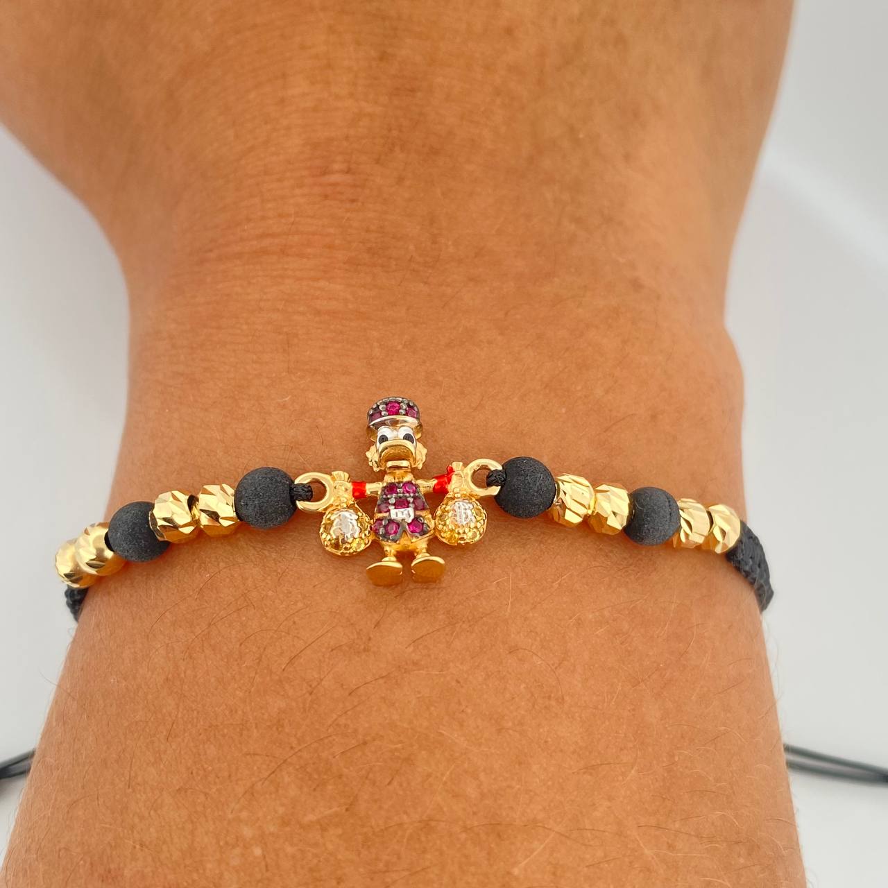 Pulsera Tejida Negra Pato Bolsas de Dinero 2.2gr / 4mm Tres Oros 18K % Pulsera Tejida Negra Pato Bolsas de Dinero 2.2gr / 4mm Tres Oros 18K %