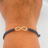 Pulsera Tejida Negra Infinito 0.85gr / Oro Amarillo 18K % Pulsera Tejida Negra Infinito 0.85gr / Oro Amarillo 18K %