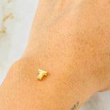 Herraje Letra T 0.25gr / 0.6cm / Oro Amarillo 18K © Herraje Letra T 0.25gr / 0.6cm / Oro Amarillo 18K ©
