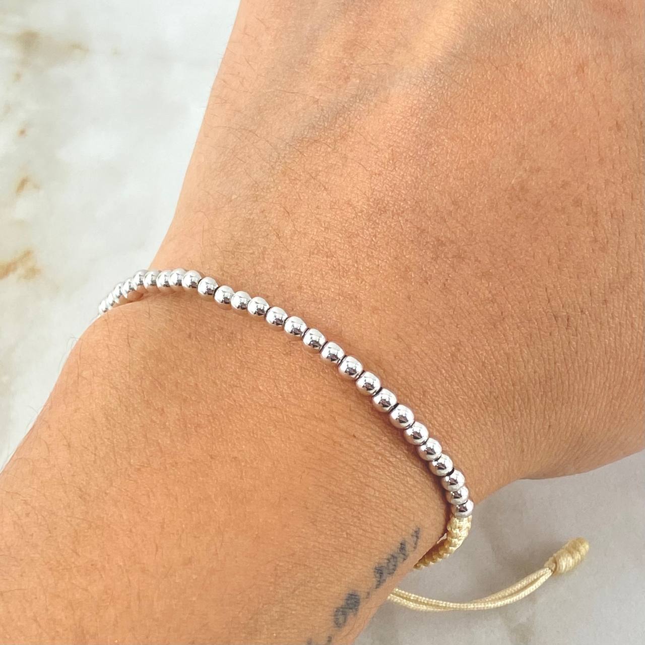 Pulsera Beige Bolas Lisas 1.5gr / Oro Blanco 18K *