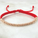 Pulsera Roja Bolas Lisas 1.5gr / Oro Rosa 18K *