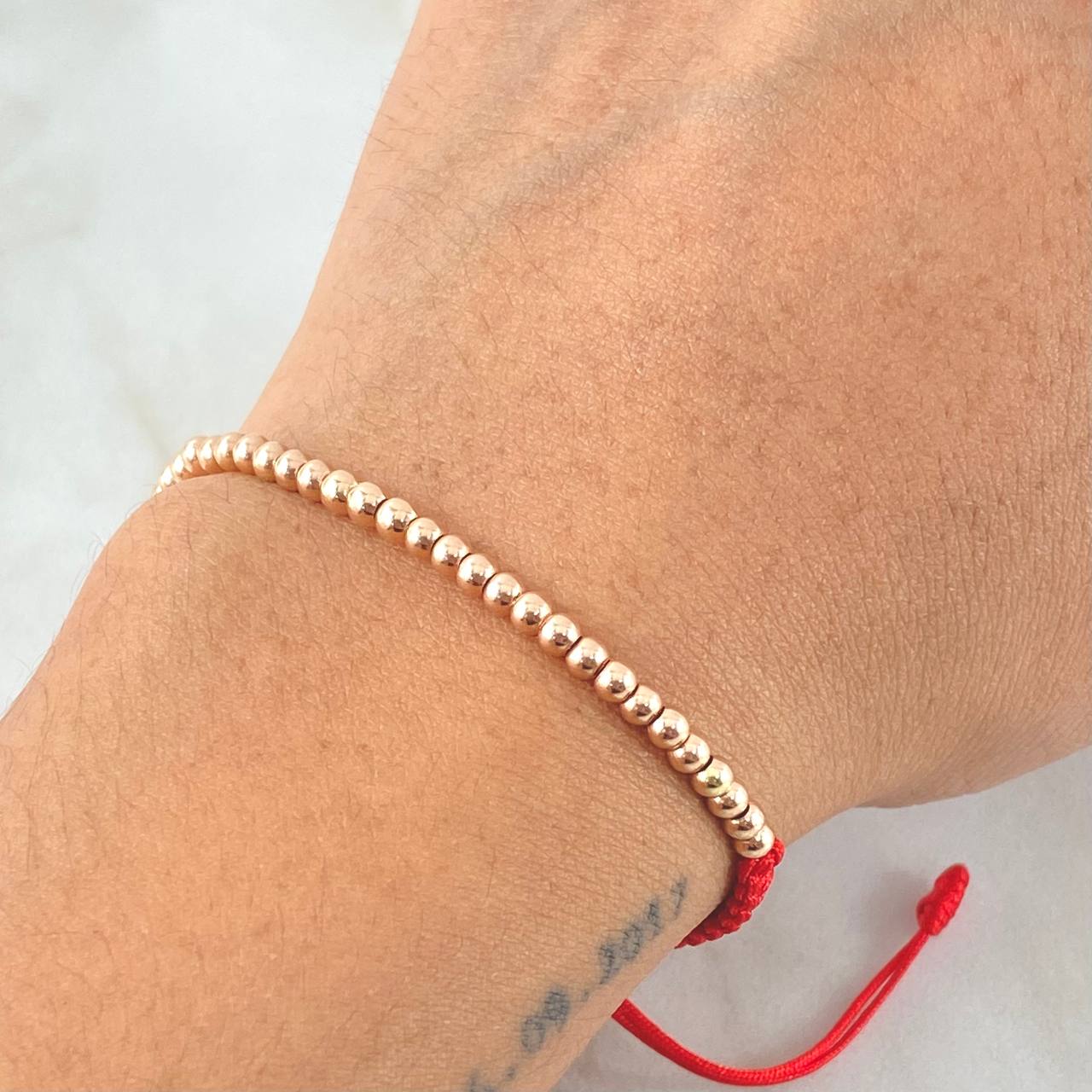 Pulsera Roja Bolas Lisas 1.5gr / Oro Rosa 18K *