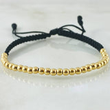 Pulsera Negra Bolas Lisas 1.5gr / Oro Amarillo 18K *