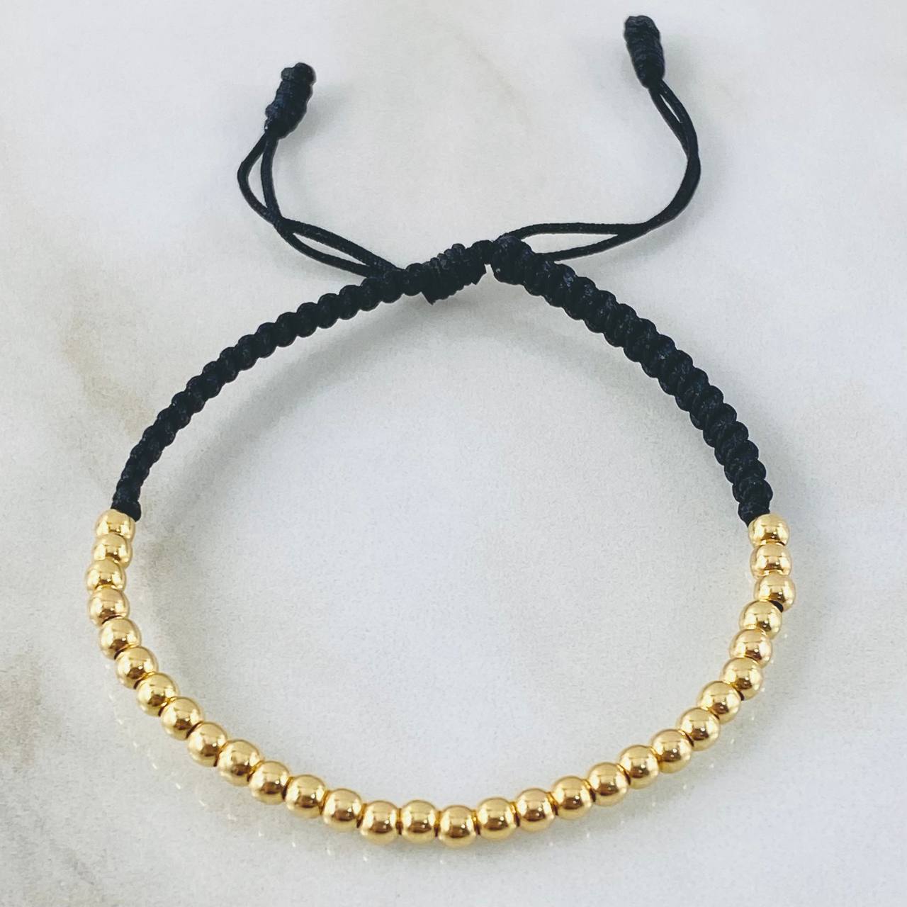 Pulsera Negra Bolas Lisas 1.5gr / Oro Amarillo 18K *