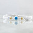 Pulsera Blanca Ojo Turco 4mm Bolas Diamantadas 2 Und Oro Amarillo 18K (A.C)
