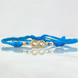 Pulsera Azul Infinito 0.55gr / 3mm Bolas Diamantadas 2 Und Oro Amarillo 18K *