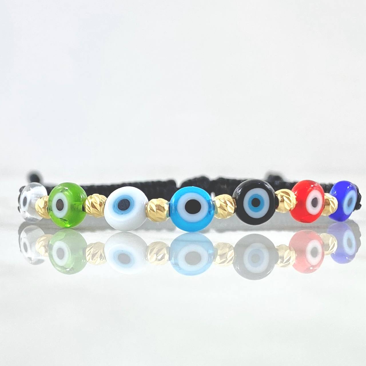 Pulsera Negra Ojo Turco 0.4gr / 3mm Bolas Diamantadas 6 Und Oro Amarillo 18K (A.C)