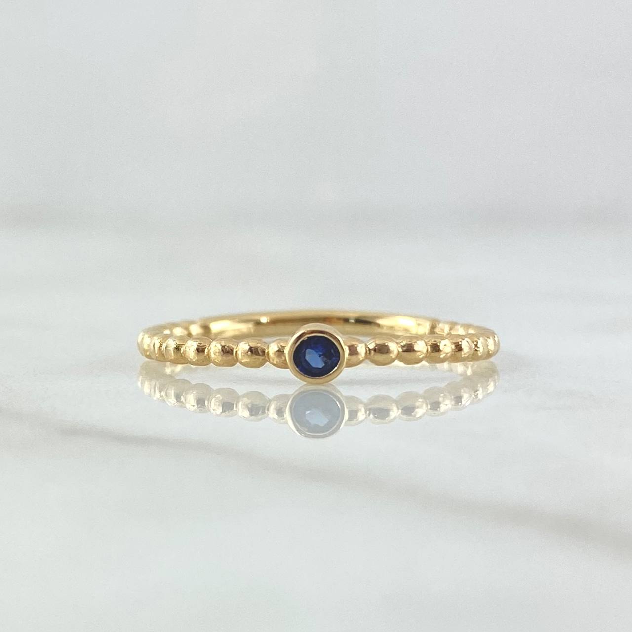 Anillo Solitario Bisel Esferas 1.7gr / T7 3/4 / Circon Azul Rey Oro Amarillo 18K *