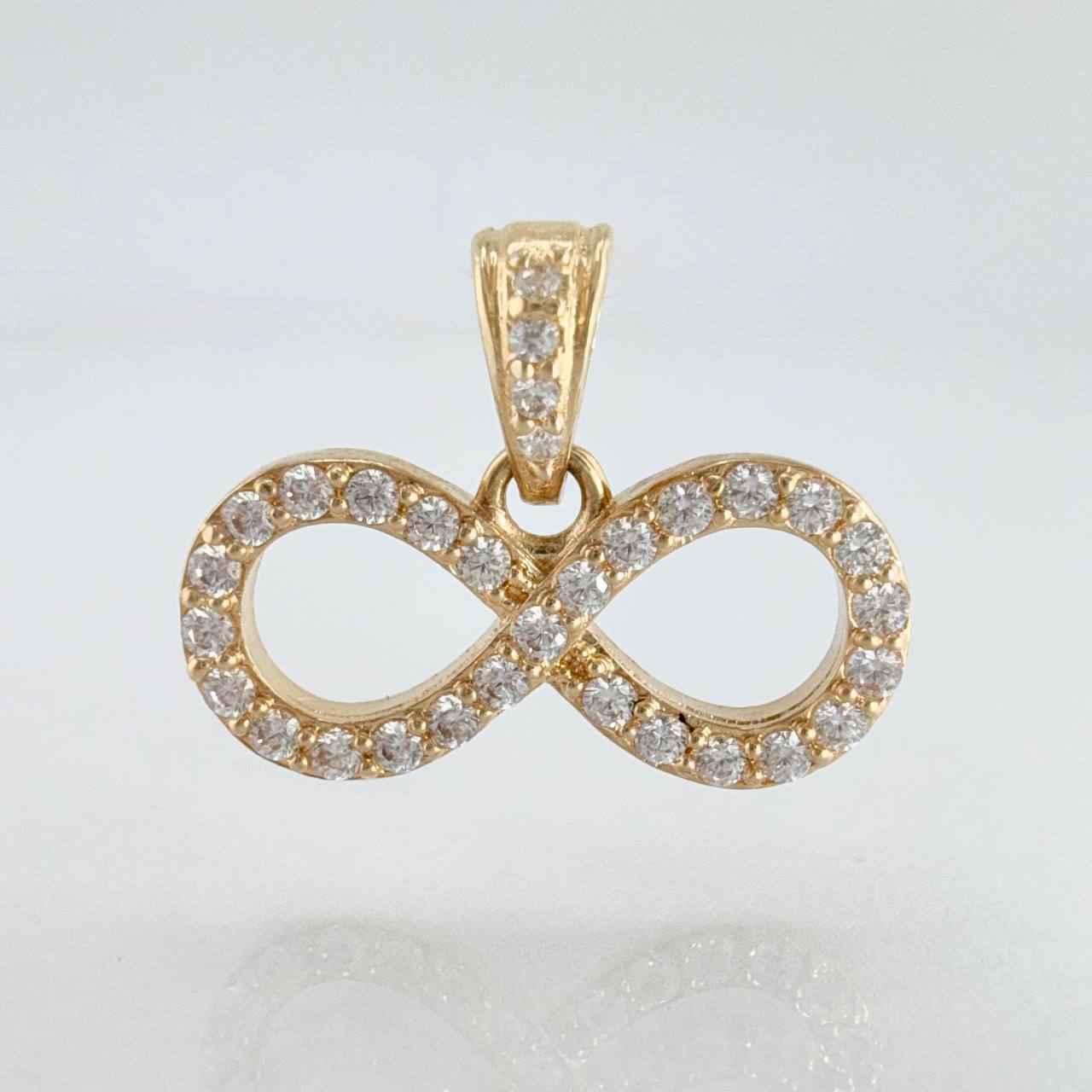 Dije Silueta Infinito Tupido 1.25gr / 1.7cm / Oro Amarillo 18K ©