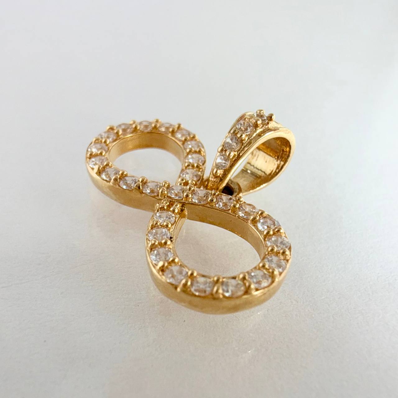 Dije Silueta Infinito Tupido 1.25gr / 1.7cm / Oro Amarillo 18K ©