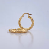 Candongas Mafe 2.35gr / 2.3cm / Entorchadas Oro Amarillo 18K $