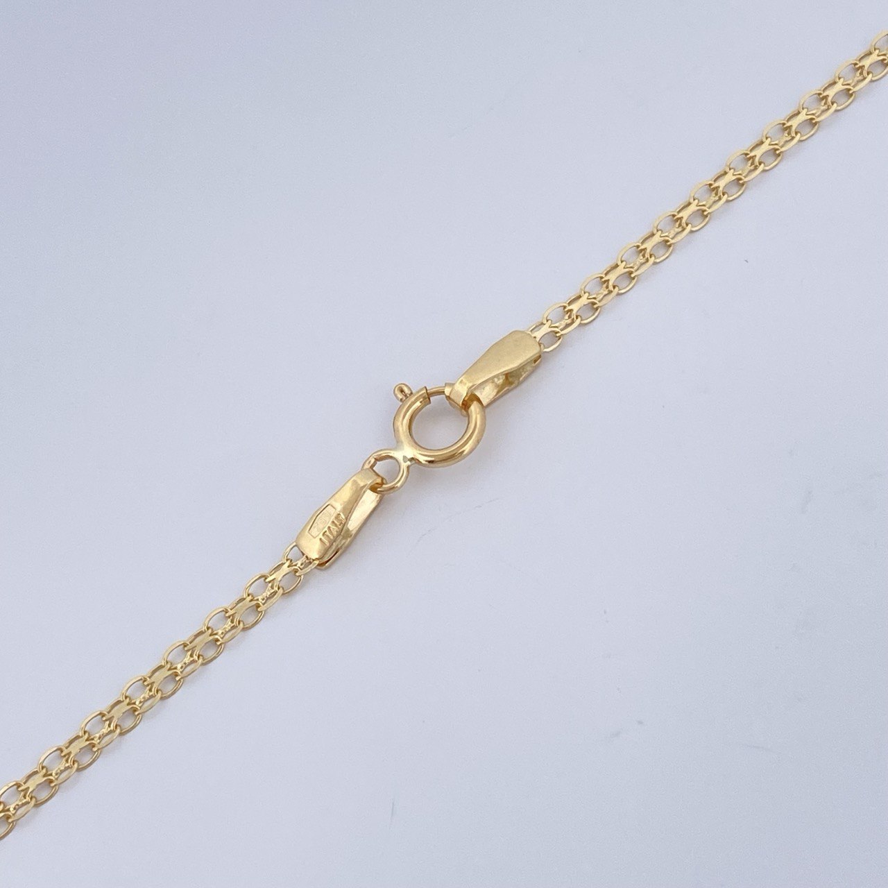 Cadena China 2.6gr / 60.3cm / Oro Amarillo +1 18K &