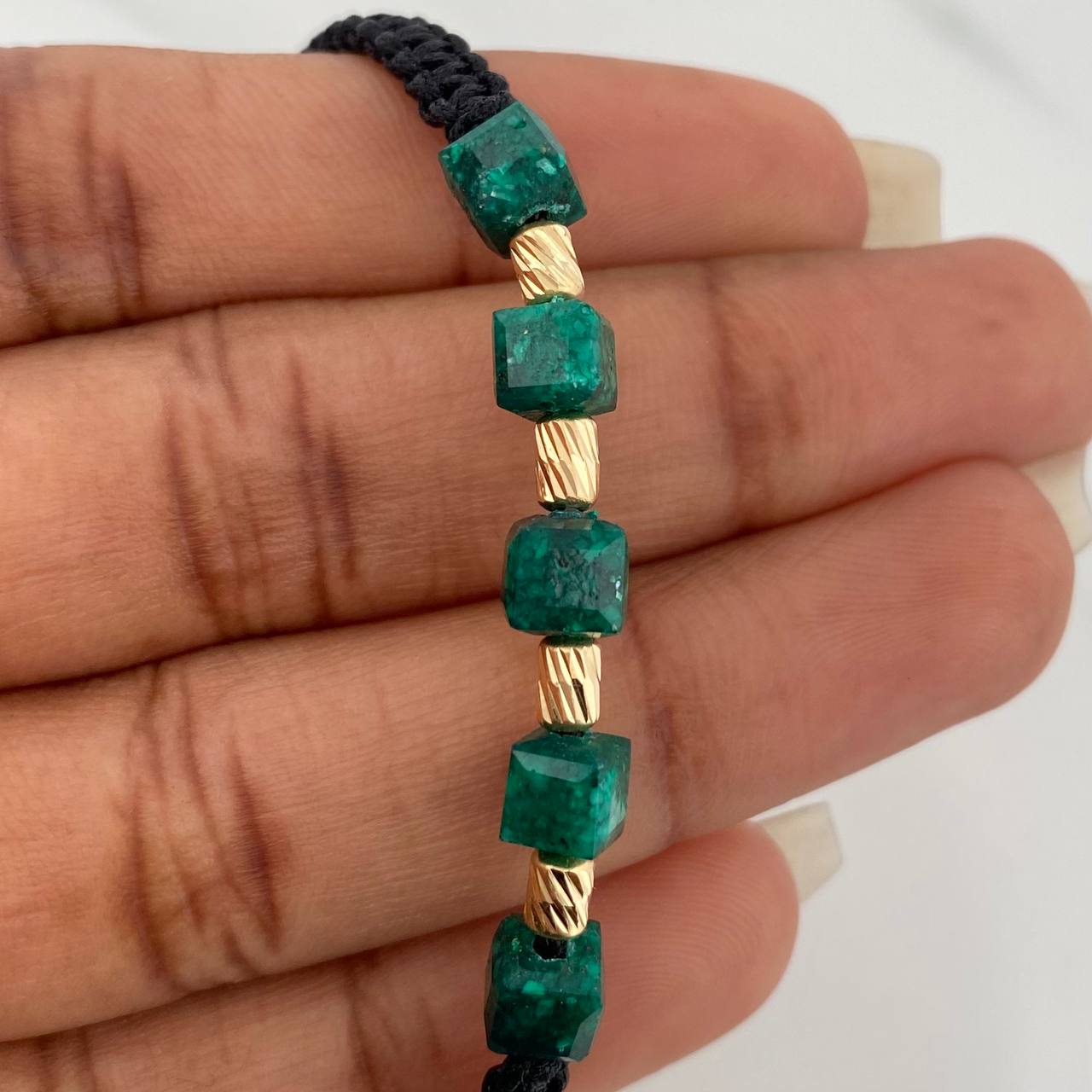 Pulsera Negra Morralla Cubica 5mm Cilindros 4 und Oro Amarillo 18K $