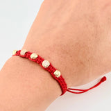 Pulsera Tejida Roja Bolas Diamantadas Oro Amarillo 18K