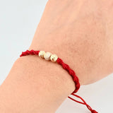 Pulsera Tejida Roja Bolas Diamantadas Oro Amarillo 18K