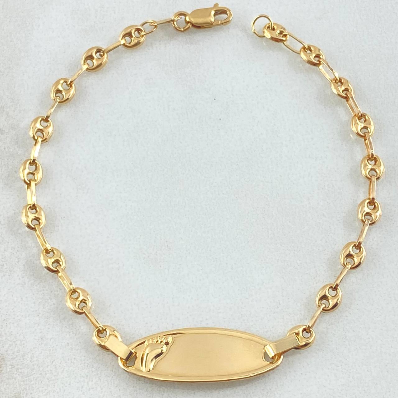 Pulso Bebé Placa Ovalada Huella Pie 1.95gr / 15cm / Oro Amarillo 18K