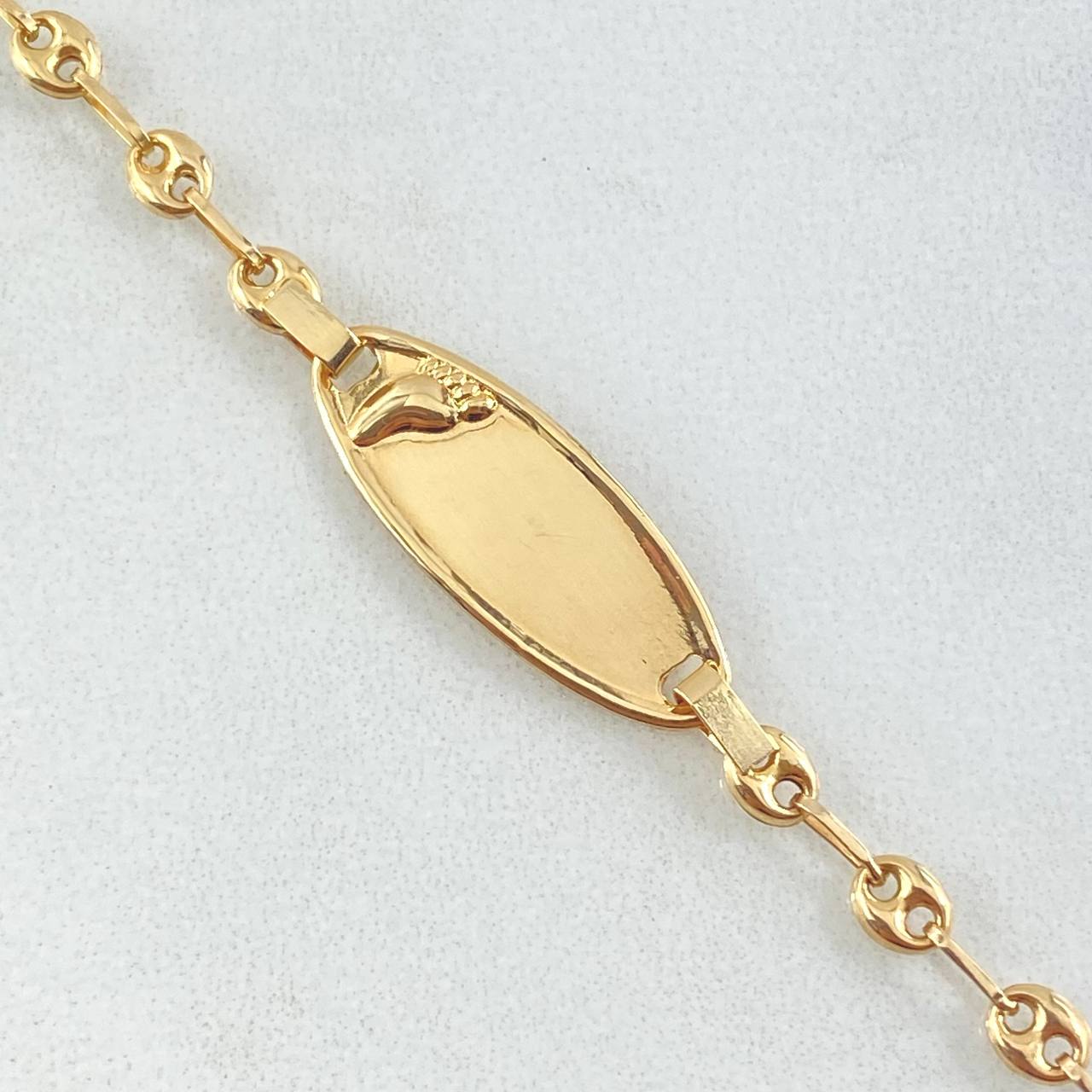 Pulso Bebé Placa Ovalada Huella Pie 1.95gr / 15cm / Oro Amarillo 18K