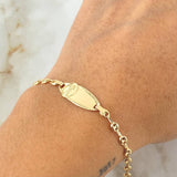 Pulso Bebé GC Placa Ovalada Divino Niño 2gr / 15.5cm / Oro Amarillo 18K ©