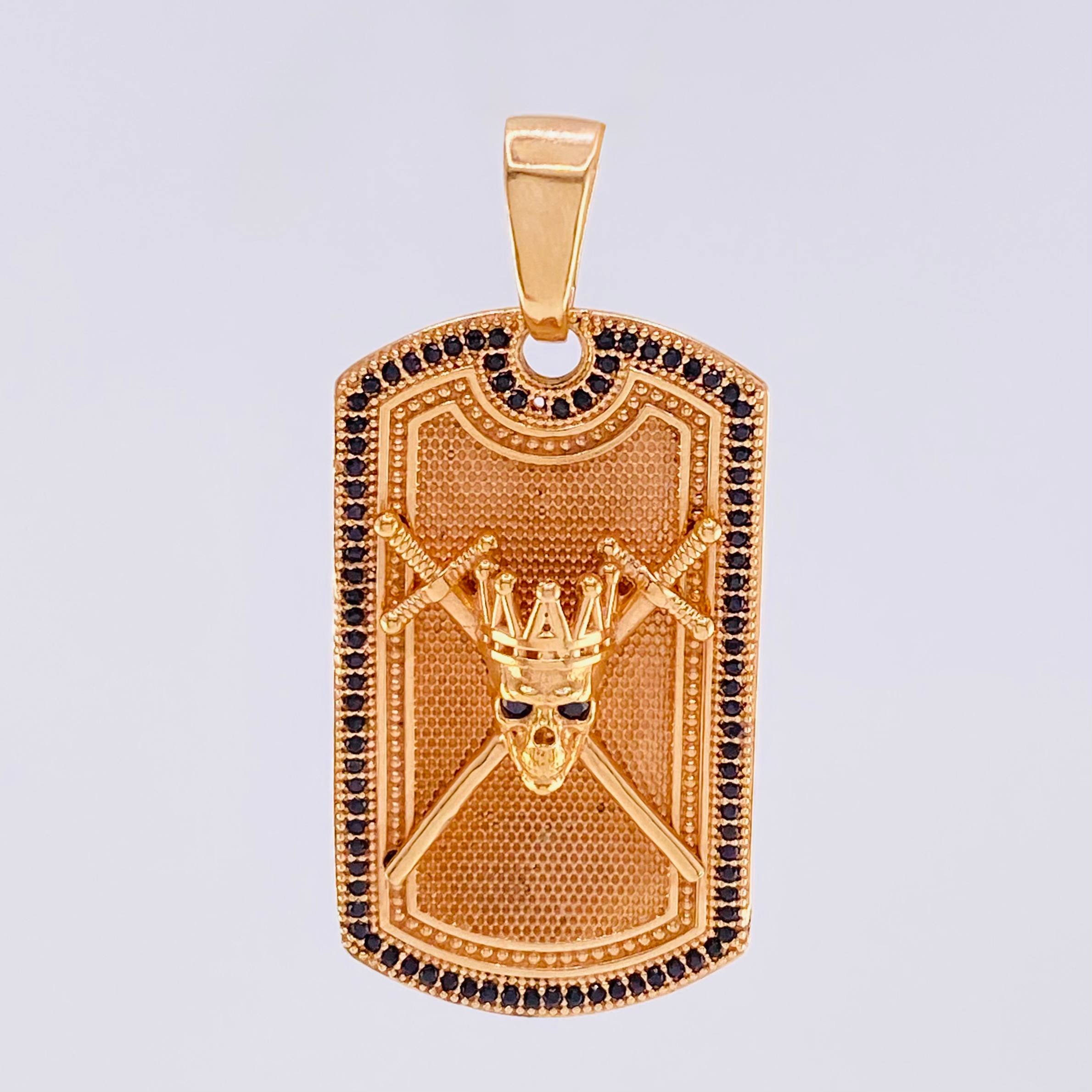 Dije Placa Calavera Espadas 14.6gr / 4.5cm / Rectangulo Circones Negros Oro Rosa