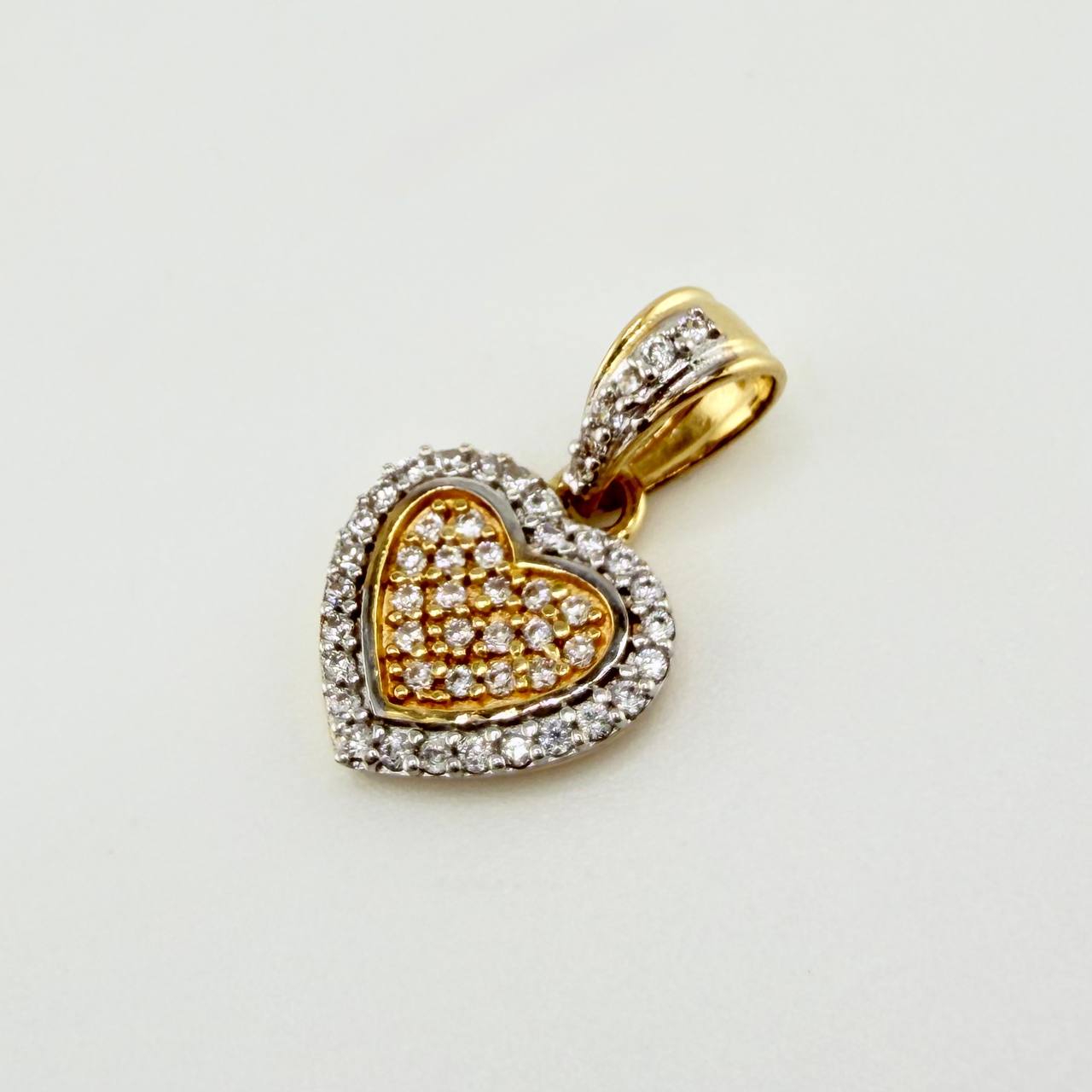 Dije Corazon Tupido 1.45gr / 1.8cm / Dos Oros Amarillo Blanco 18K