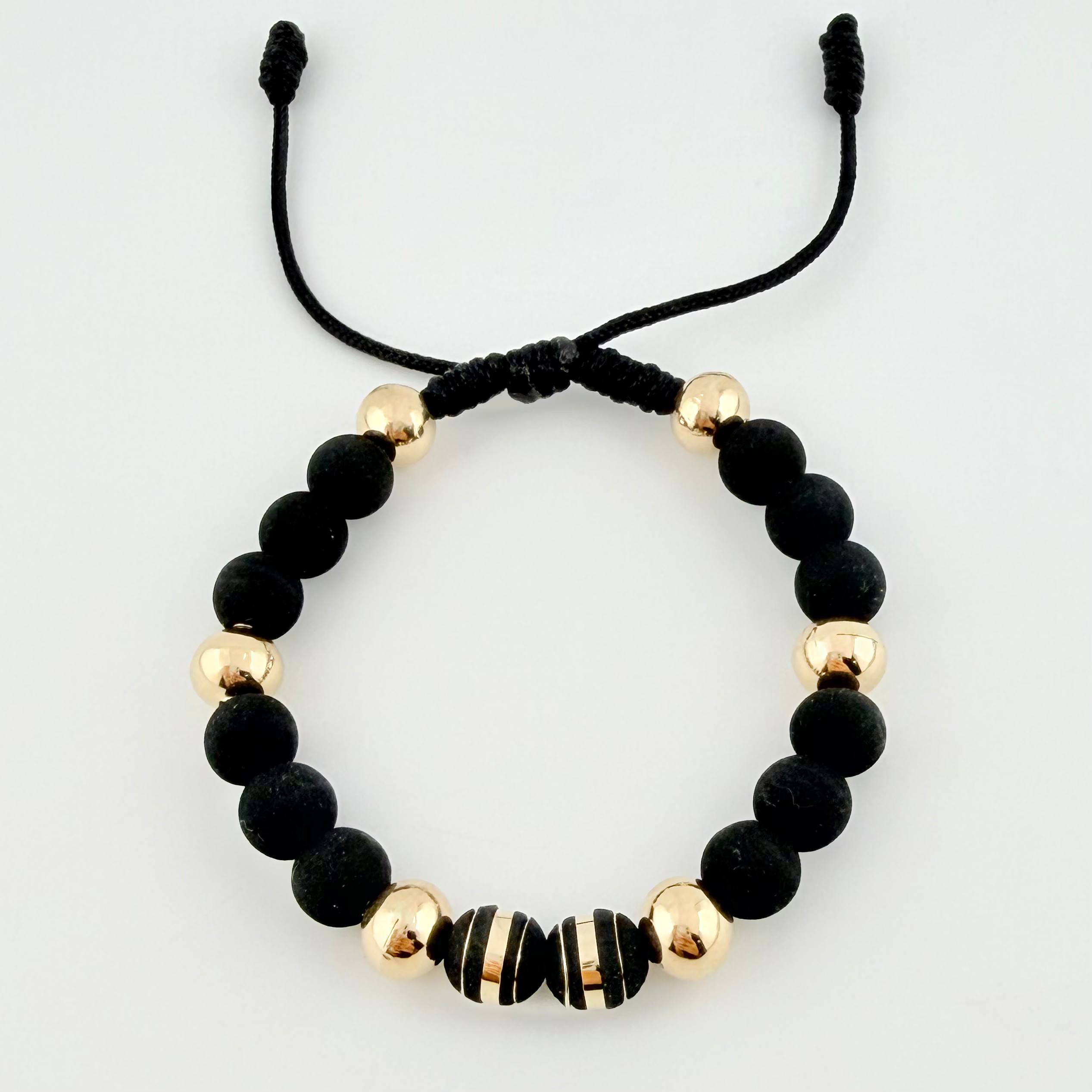 Pulsera Negra Neoros 2und Bolas 6und 1.85gr / 8mm Oro Amarillo 18K ©