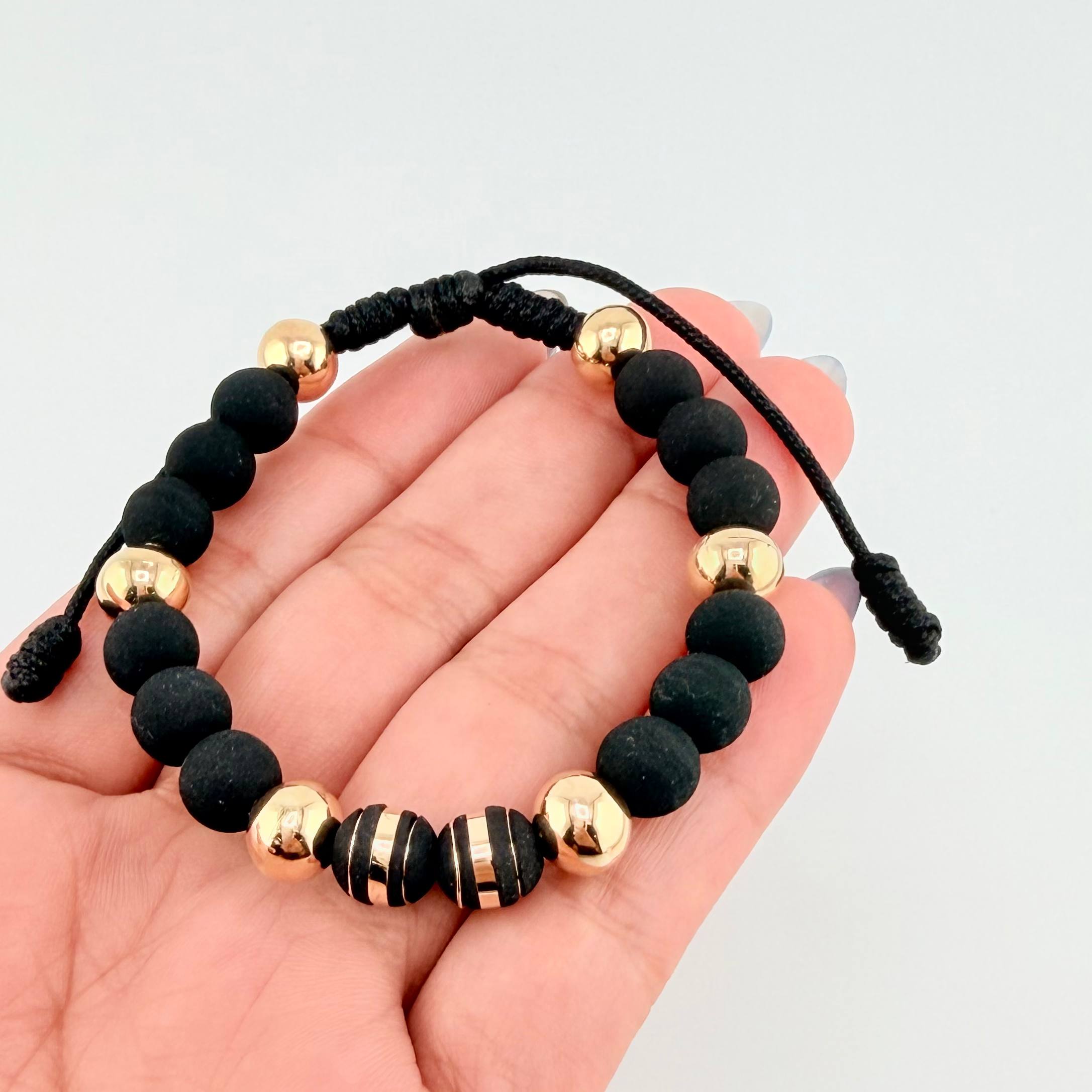 Pulsera Negra Neoros 2und Bolas 6und 1.85gr / 8mm Oro Amarillo 18K ©