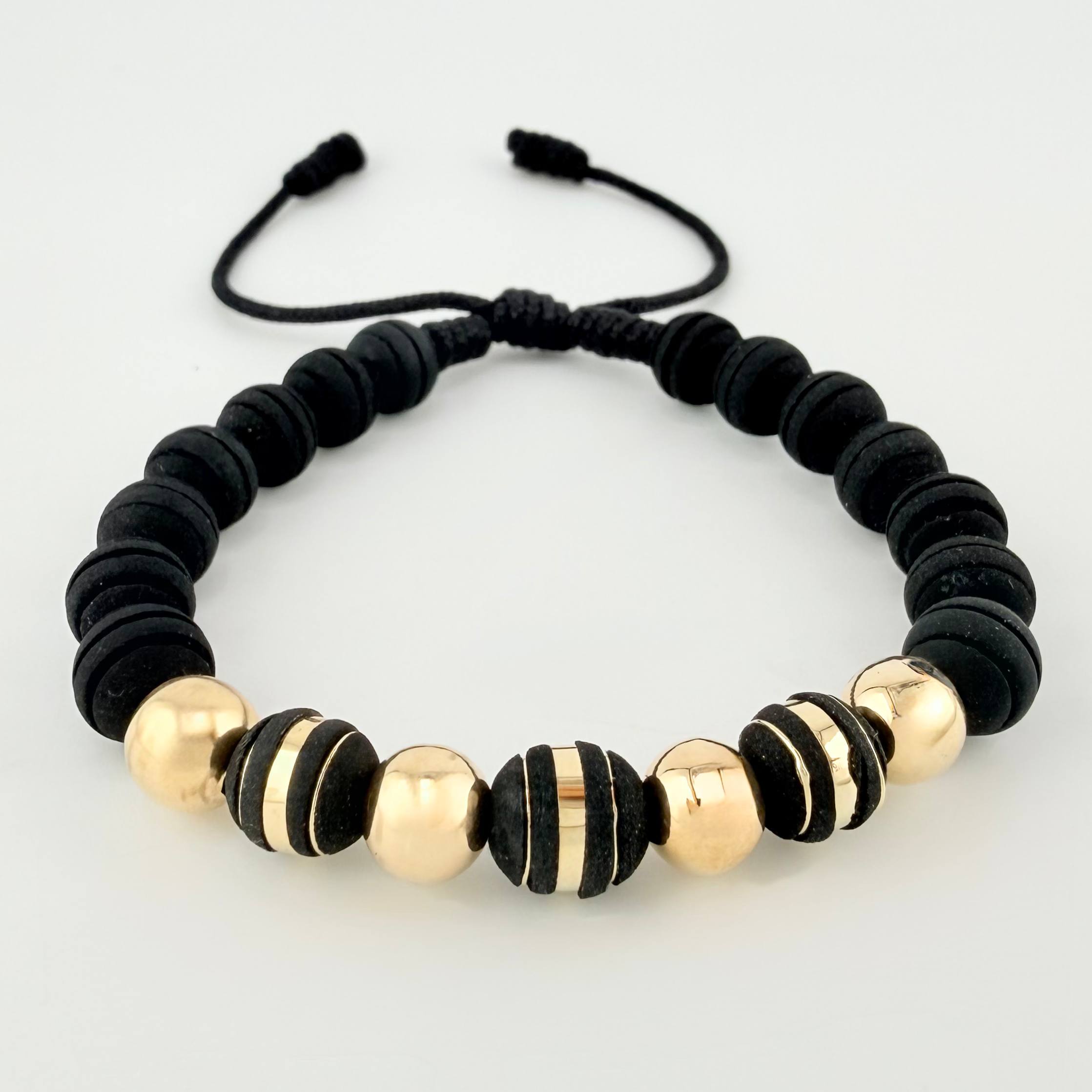 Pulsera Negra Neoros 3und Bolas 4und 1gr / 7mm Oro Amarillo 18K ©