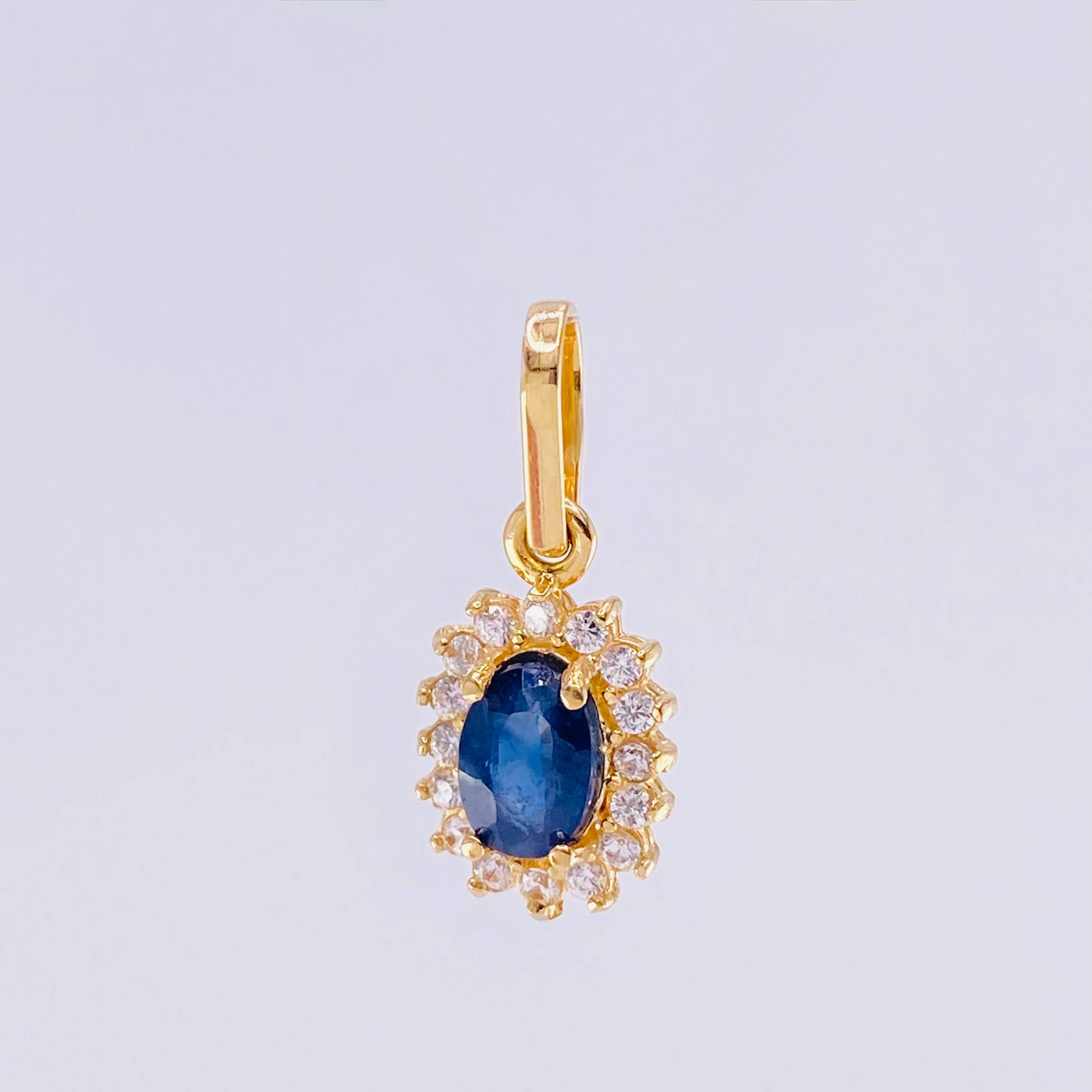 Dije Óvalo Tupido Zafiro 65pts 1.3g / 1.8cm Oro Amarillo 18K