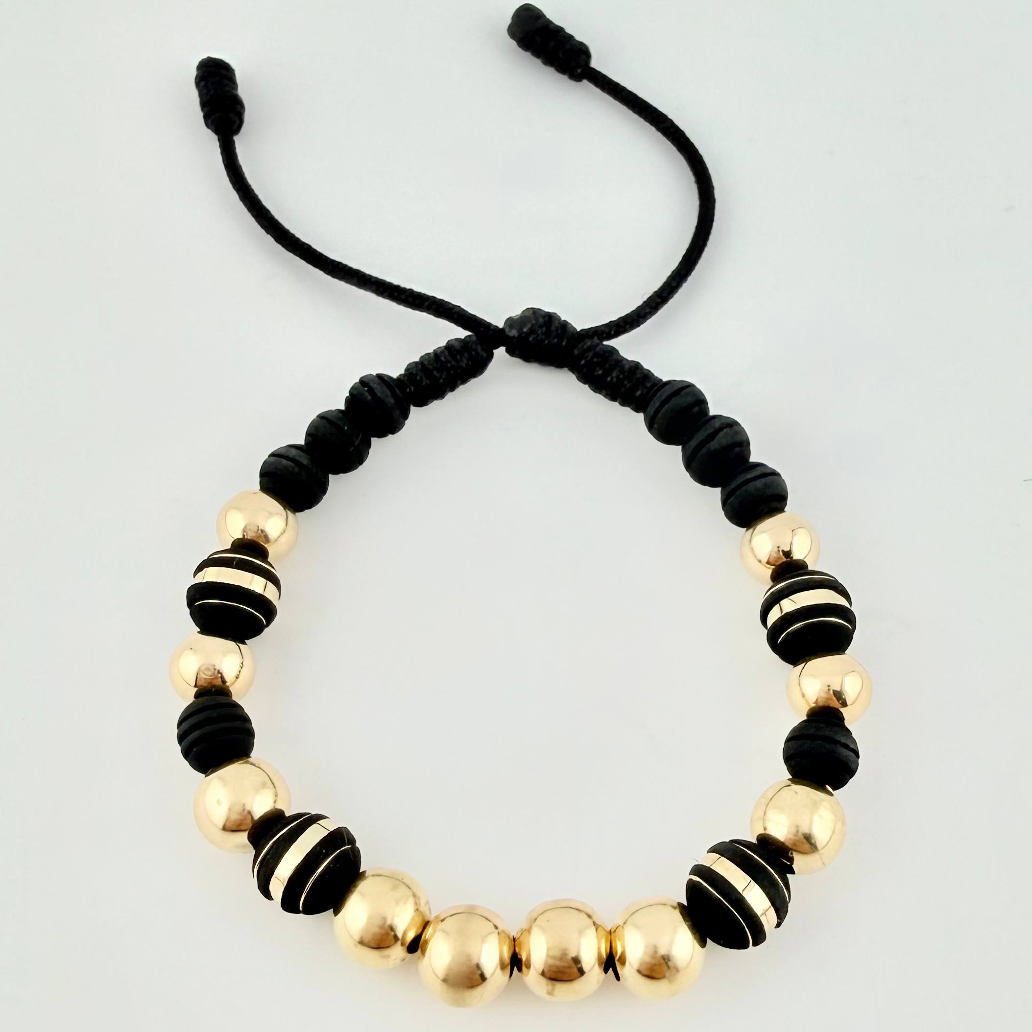 Pulsera Negra Neoros 4und Bolas 10und 3.1gr / 8mm Oro Amarillo 18K *