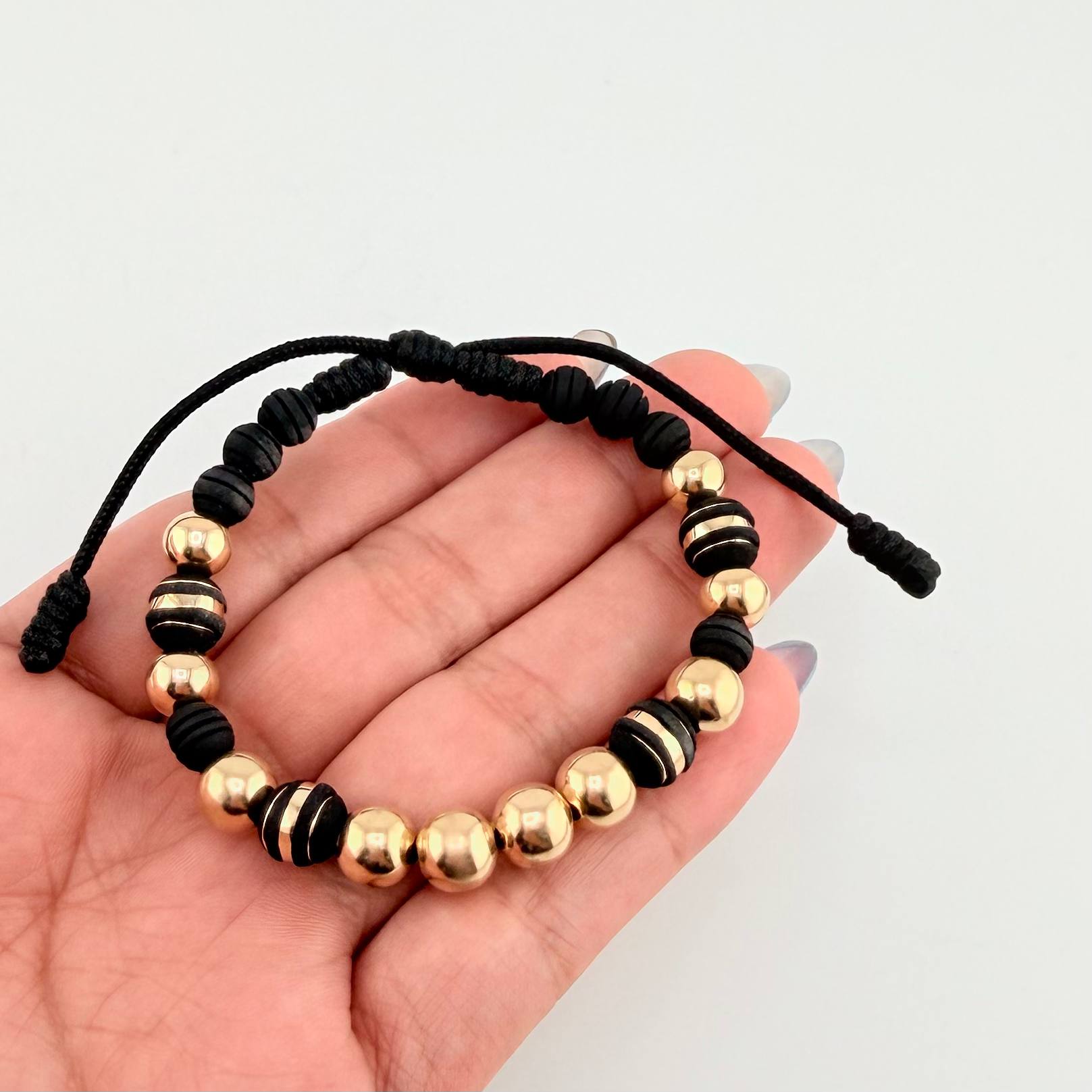 Pulsera Negra Neoros 4und Bolas 10und 3.1gr / 8mm Oro Amarillo 18K *