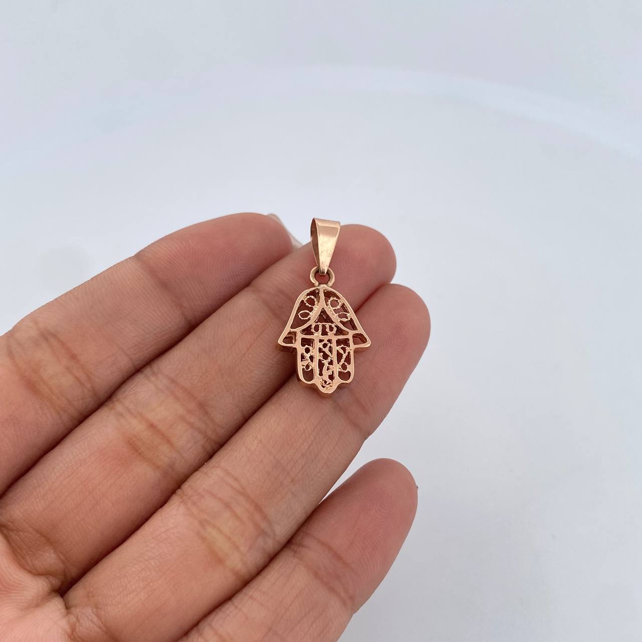 Dije Mano Hamsa 2.25gr / 2.6cm / Oro Rosa 18K $
