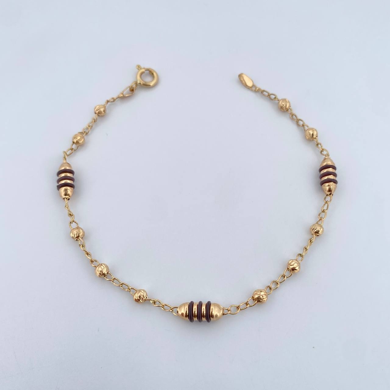 Pulso Barril 2.65gr / 18cm / 3mm Bolas Diamantadas Cauchos Cafes Oro Amarillo 18K $