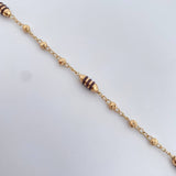Pulso Barril 2.65gr / 18cm / 3mm Bolas Diamantadas Cauchos Cafes Oro Amarillo 18K $