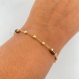 Pulso Barril 2.65gr / 18cm / 3mm Bolas Diamantadas Cauchos Cafes Oro Amarillo 18K $