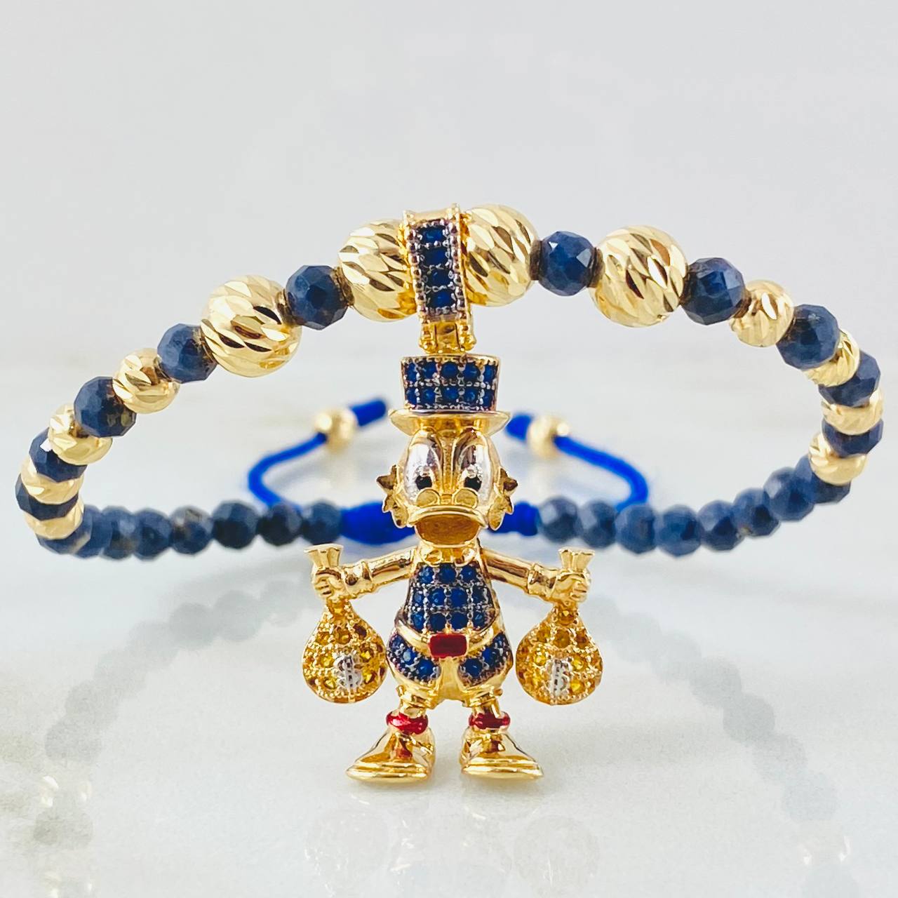 Pulsera Zafiro Dije Pato Bolsas Dinero 8.1gr / 6mm-4mm Oro Amarillo 18K ©
