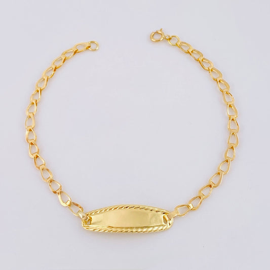 Pulso Bebé Espiga Placa Ovalada  Bordeada 1.2gr / 14.5cm / 2.7mm Oro Amarillo 18K ©