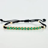Pulsera Tejida Negra Tennis Oro Amarillo 18K